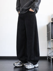 Men's black vintage washed wide leg sweatpants with pockets.