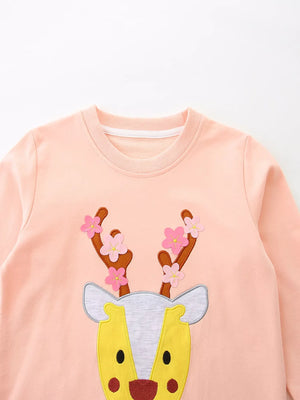 Watermelon pink cotton sweatshirt for kids with a reindeer applique and floral antlers.