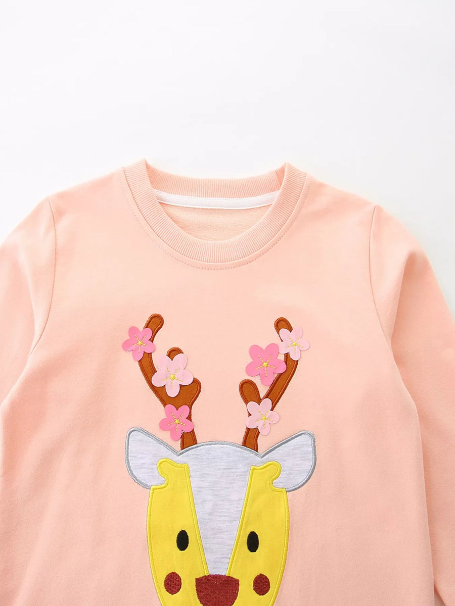 Watermelon pink cotton sweatshirt for kids with a reindeer applique and floral antlers.