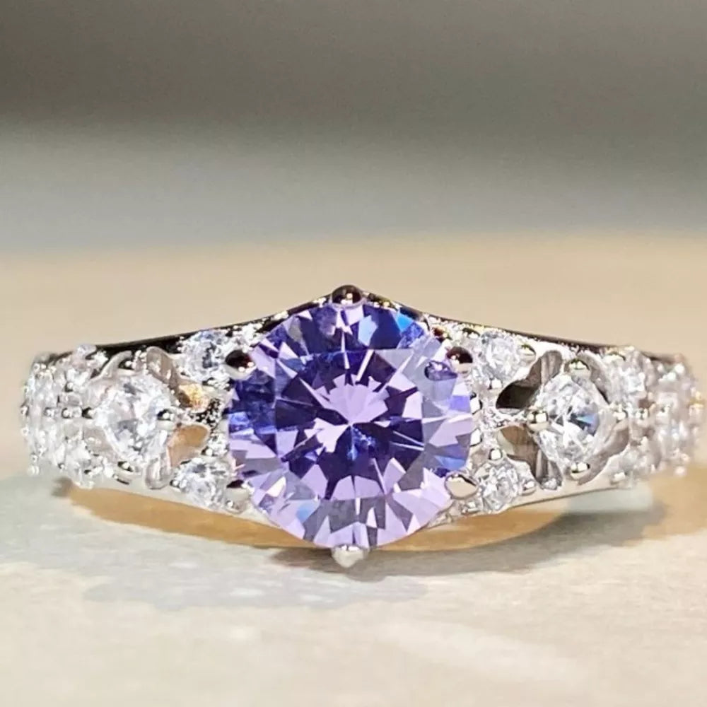 ring in silver with ornate and faceted stones