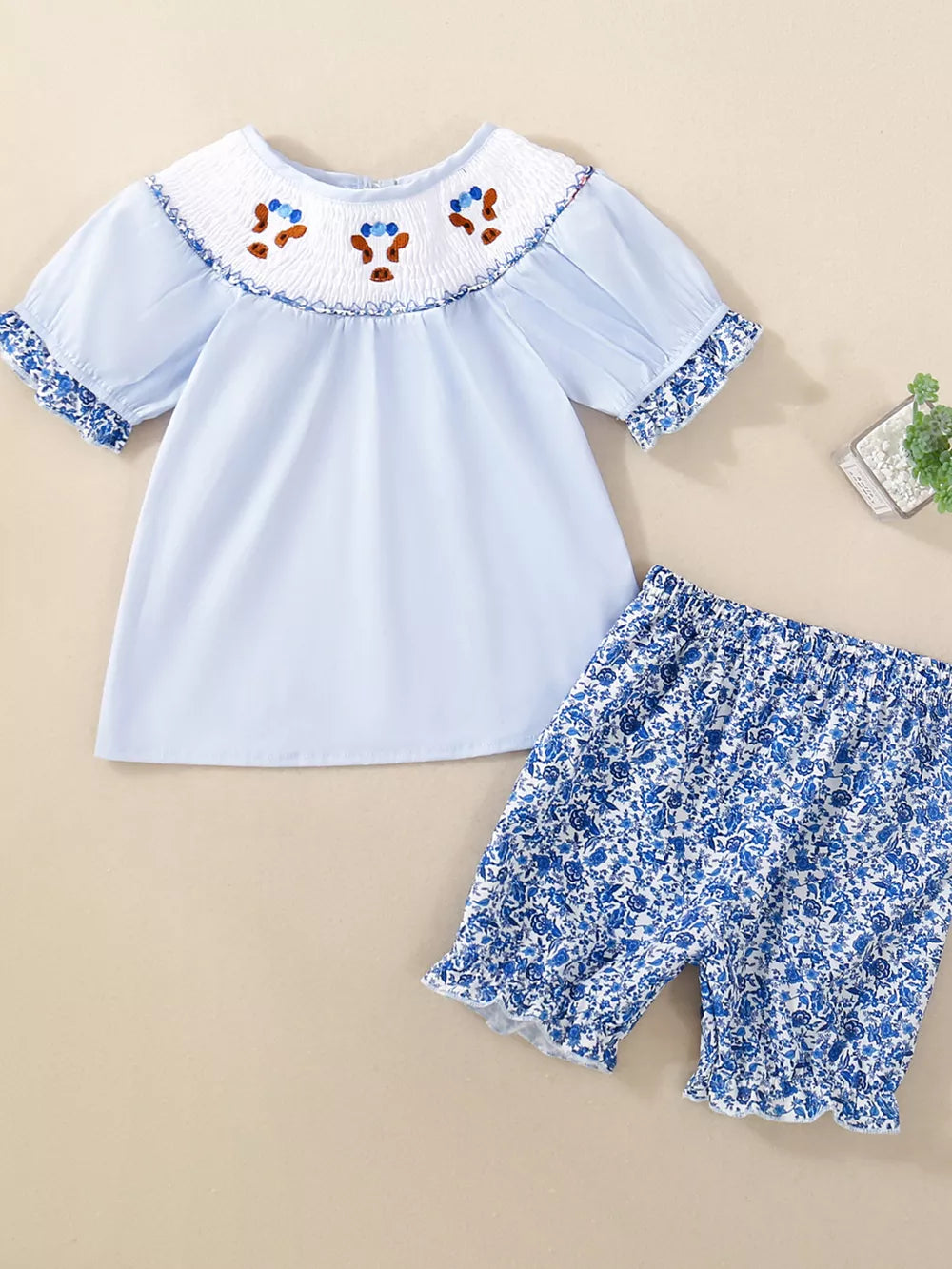Baby smocked floral set with blue top and floral shorts