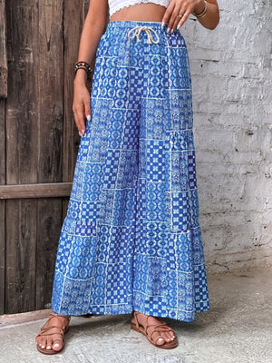 95% polyester, 5% elastane Care instructions: Machine wash cold wide-leg pants in white with flared silhouette