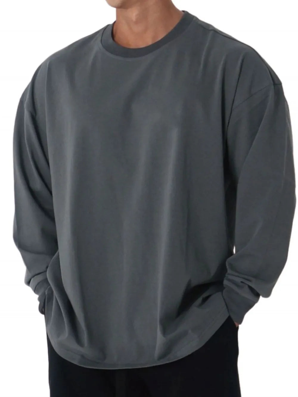 Oversized crewneck long sleeve tee in dark gray washed cotton with a relaxed fit.