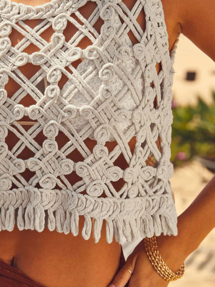 Tan macramé crop top with fringe hem and intricate woven detail.