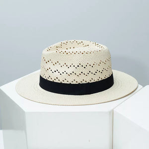 Straw boater hat with black ribbon and open weave detail