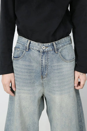 Faded light blue baggy denim jeans with a relaxed fit and classic five-pocket styling.