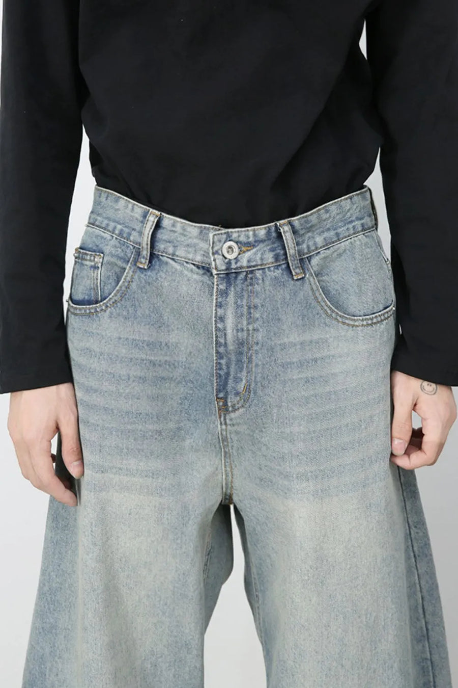 Faded light blue baggy denim jeans with a relaxed fit and classic five-pocket styling.