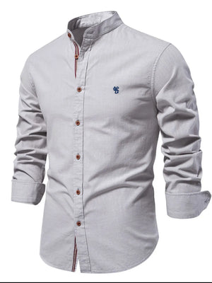 Gray linen shirt with mandarin collar, embroidered detail, and buttoned front.