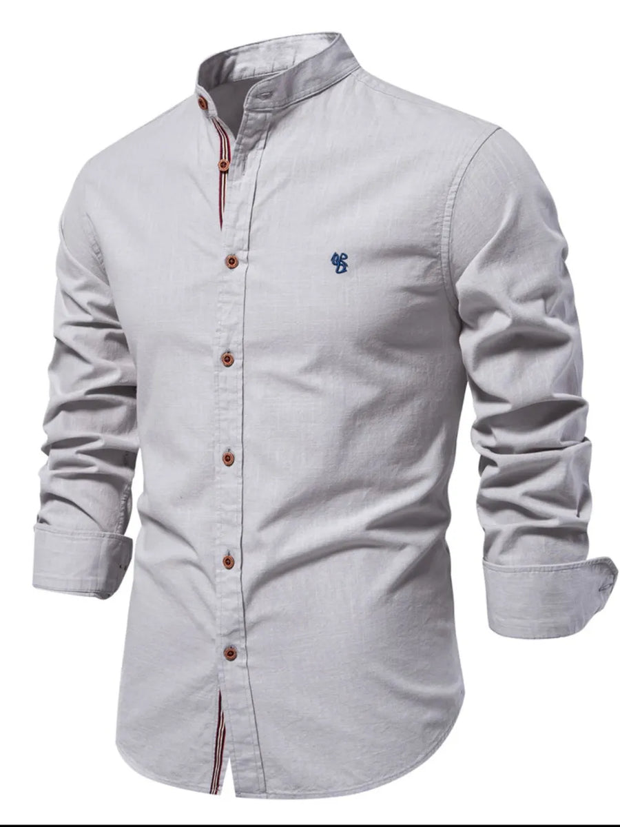Gray linen shirt with mandarin collar, embroidered detail, and buttoned front.