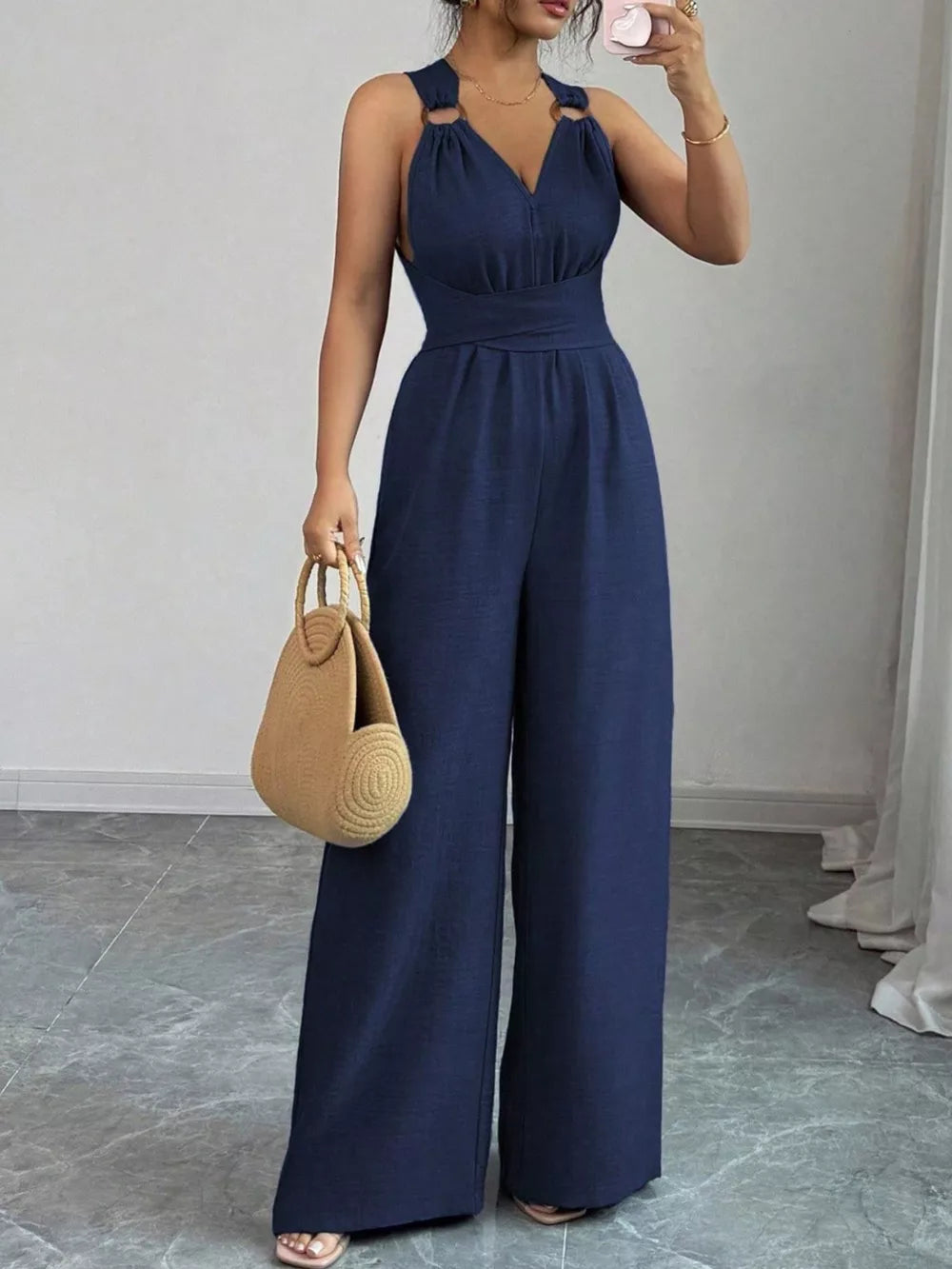 jumpsuit in navy blue featuring sleeveless and wide-leg fit