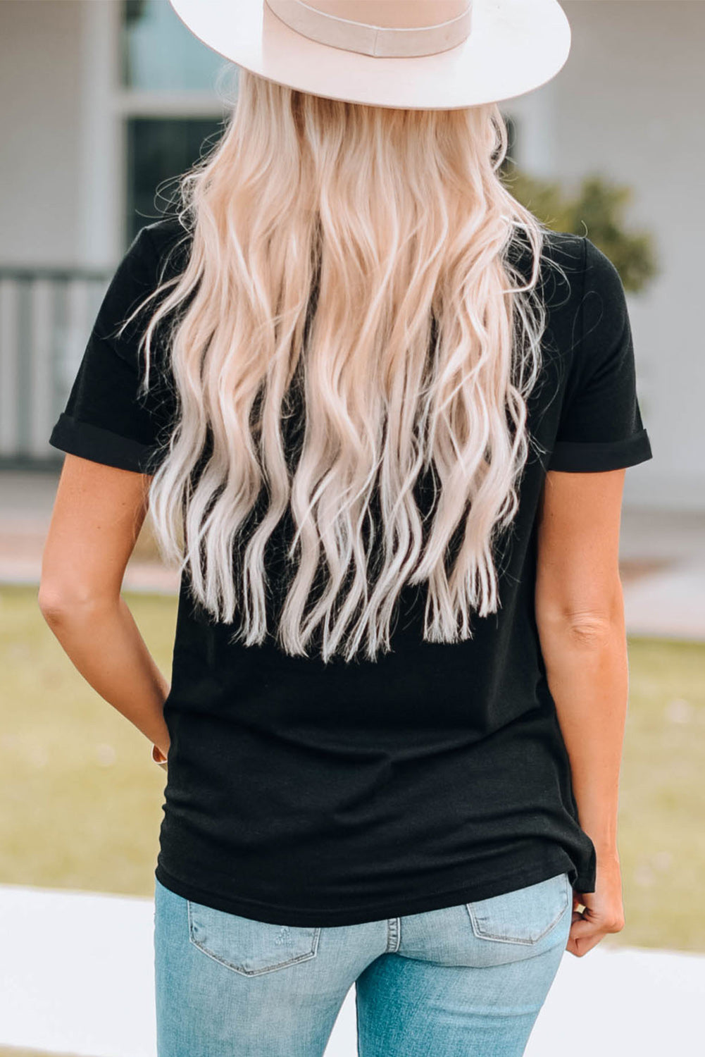 Black crew neck tee with rolled sleeves and Aztec geo print detail.