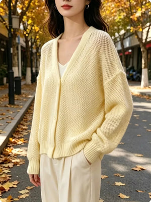 cream cardigan with button-front and open-knit