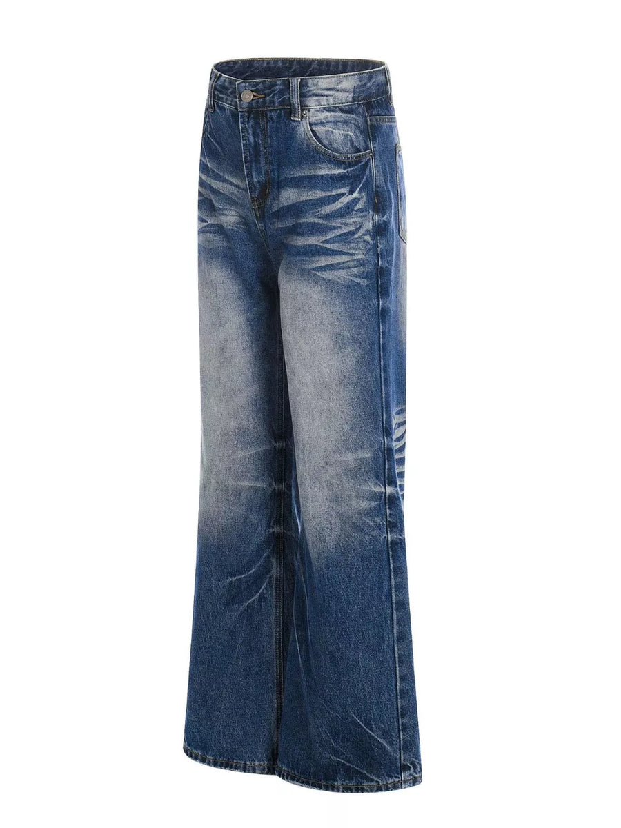 Men's light blue vintage wash wide leg jeans with distressed details