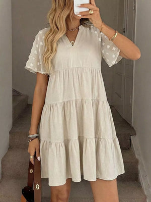 Beige tiered mini dress with sheer dot sleeves and V-neck, cotton blend, casual summer style