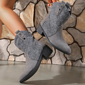 Gray suede and felt western ankle boots with decorative stitching and button details.