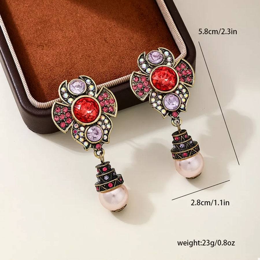 earrings in antique gold with floral and drop design