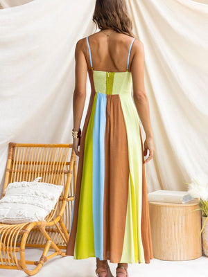 Maxi dress with smocked bodice and color block skirt in blue, brown, and lime green.