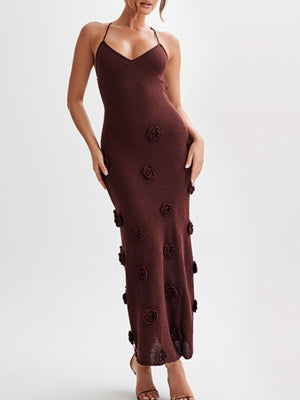 Brown knit maxi dress with 3d floral appliques and halter neck.