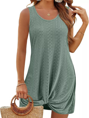Green eyelet tank dress with twisted hem detail.