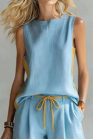 Light blue tank and shorts set with yellow contrast trim and drawstring waist.