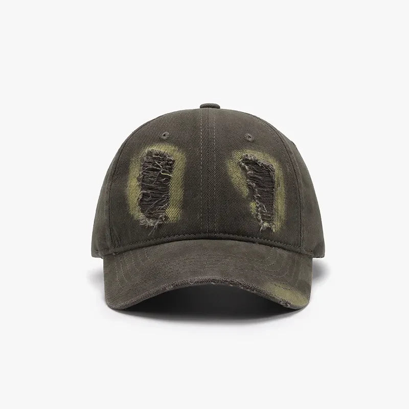 Army green distressed denim baseball cap with distressed patches and frayed brim.