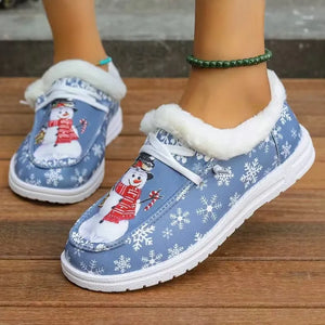 Light blue faux-fur lined loafers with snowman and snowflake print