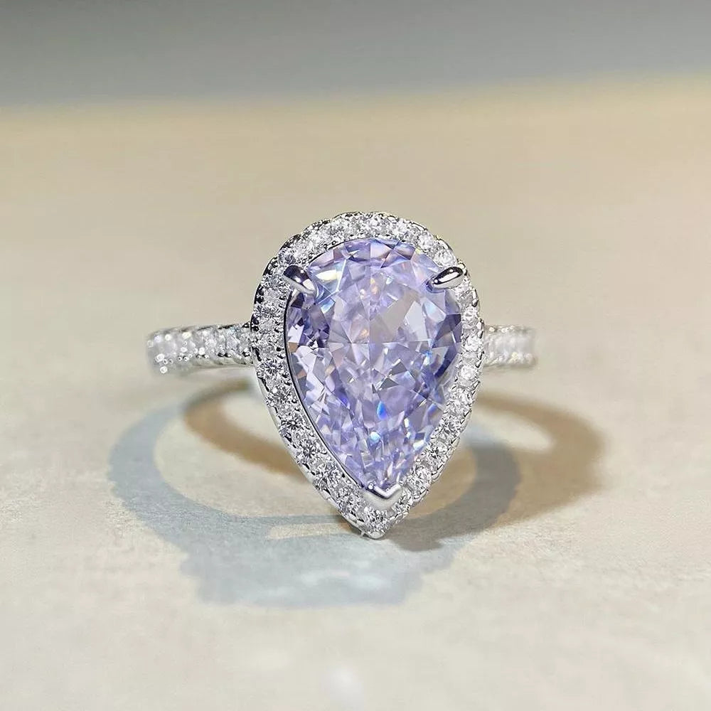 ring in silver featuring halo setting and fitted fit