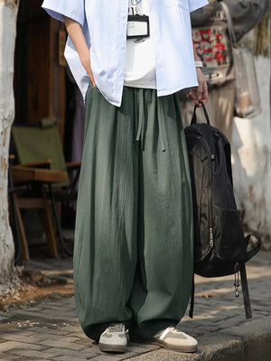 Plus size army green sweatpants with drawstring waist and wide leg.