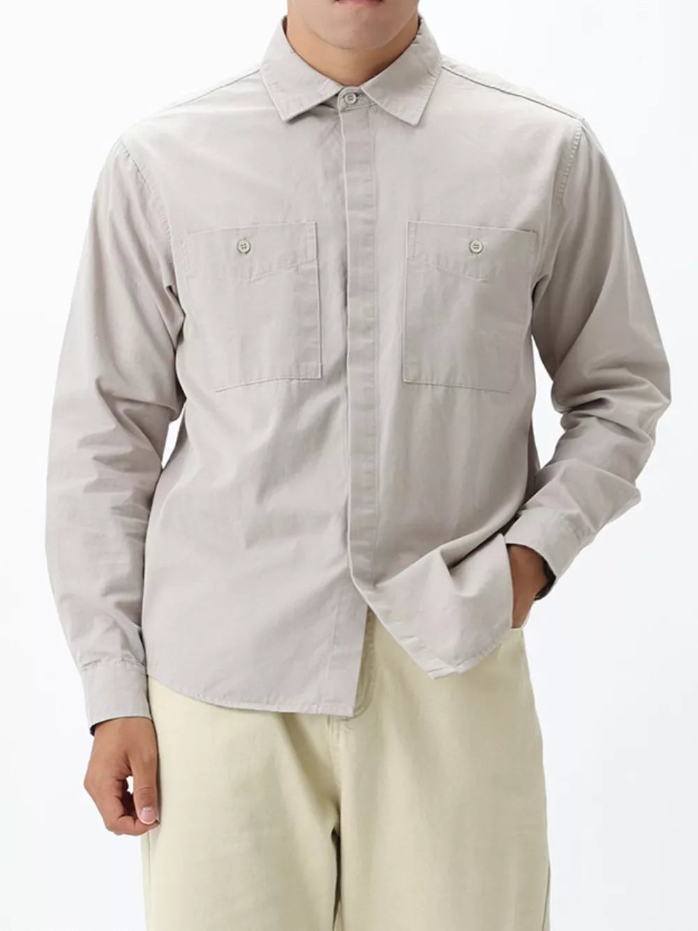 Light gray cotton button-down shirt for men with two chest pockets and button cuffs.