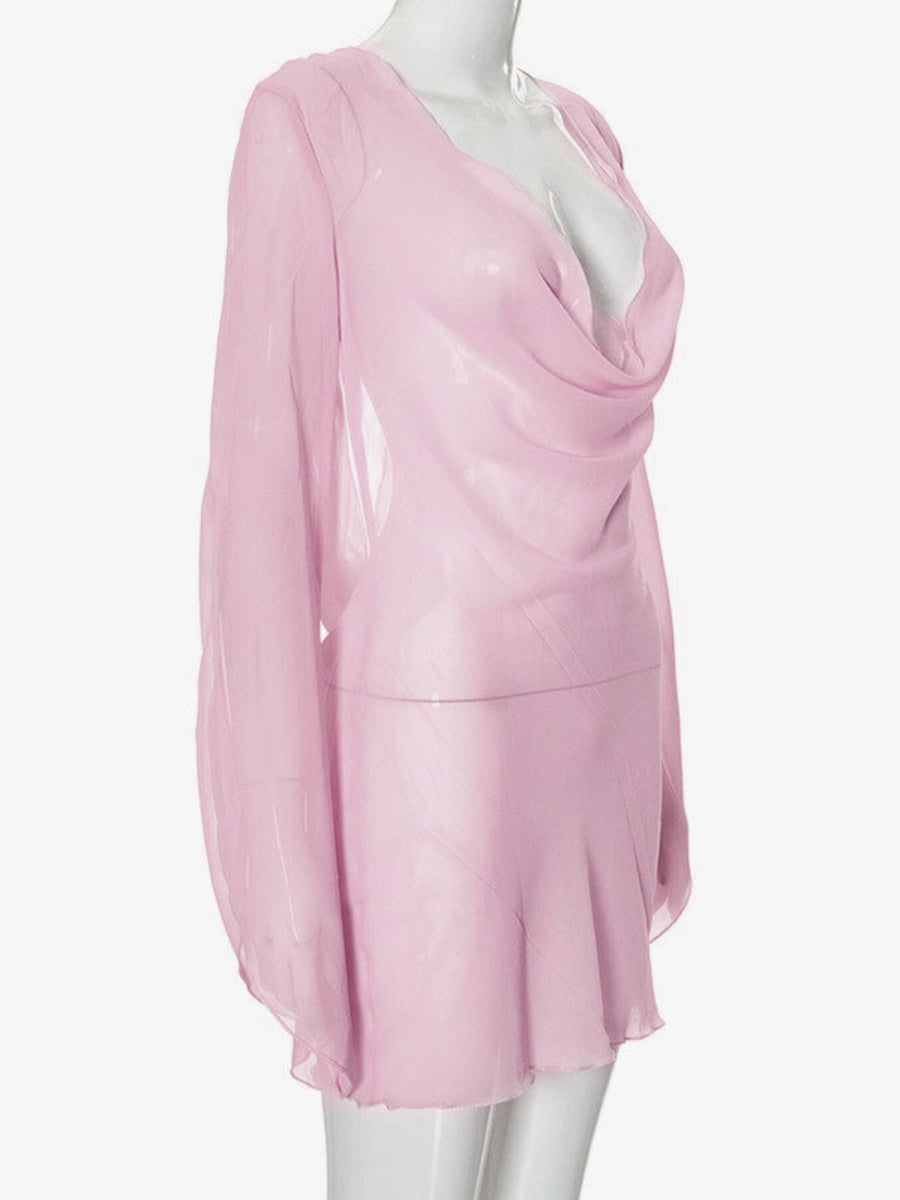 Pink sheer chiffon mini dress with draped cowl neck and long sleeves.