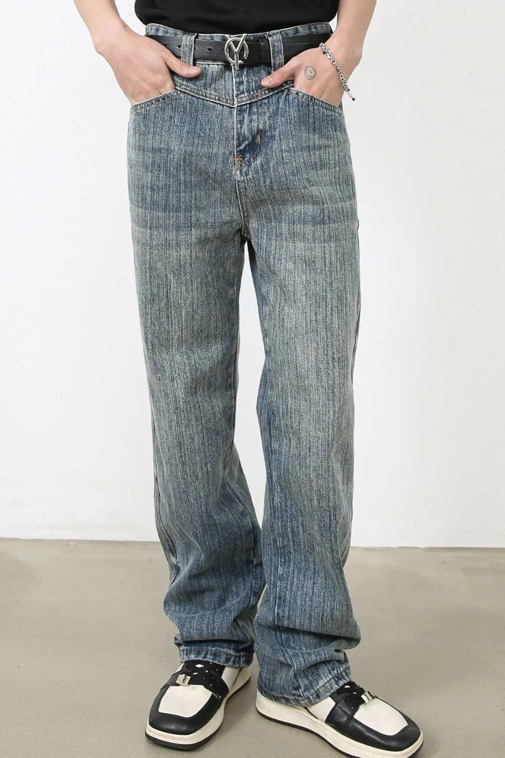 Vintage wash wide-leg denim jeans in dusty blue with vertical texture.