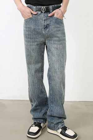 Vintage wash wide-leg denim jeans in dusty blue with vertical texture.