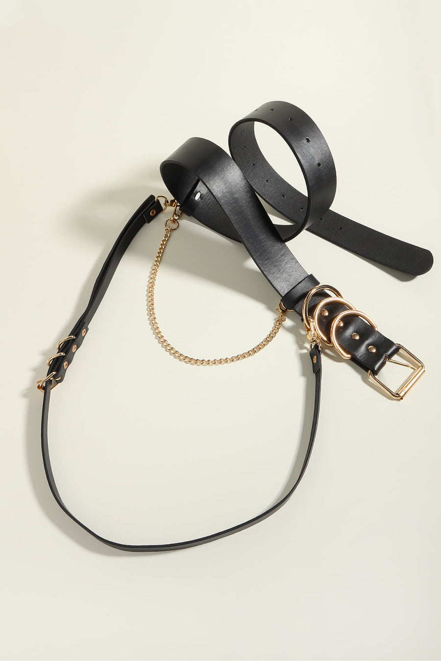 Black PU leather harness belt with gold chain detail and multiple rings.
