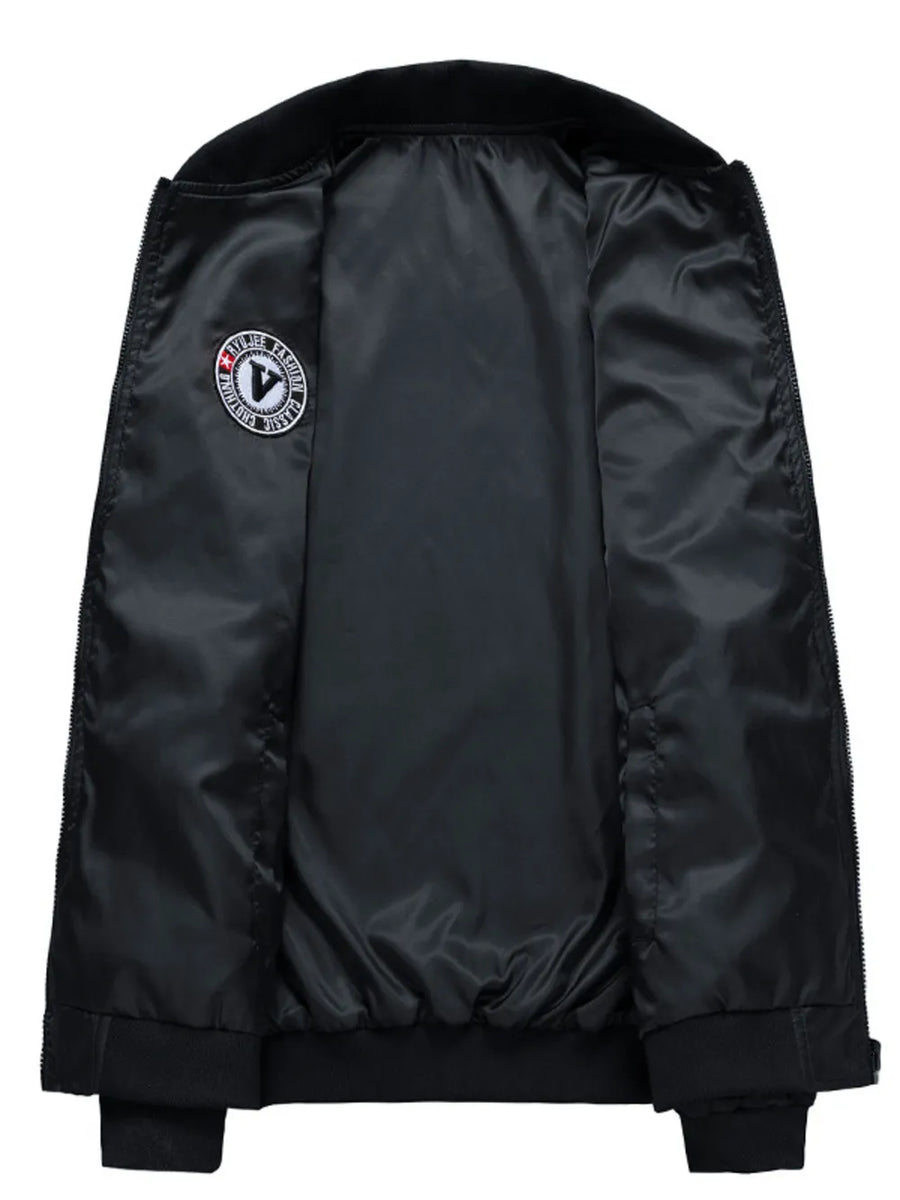 Black bomber jacket with satin lining and embroidered patch detail.