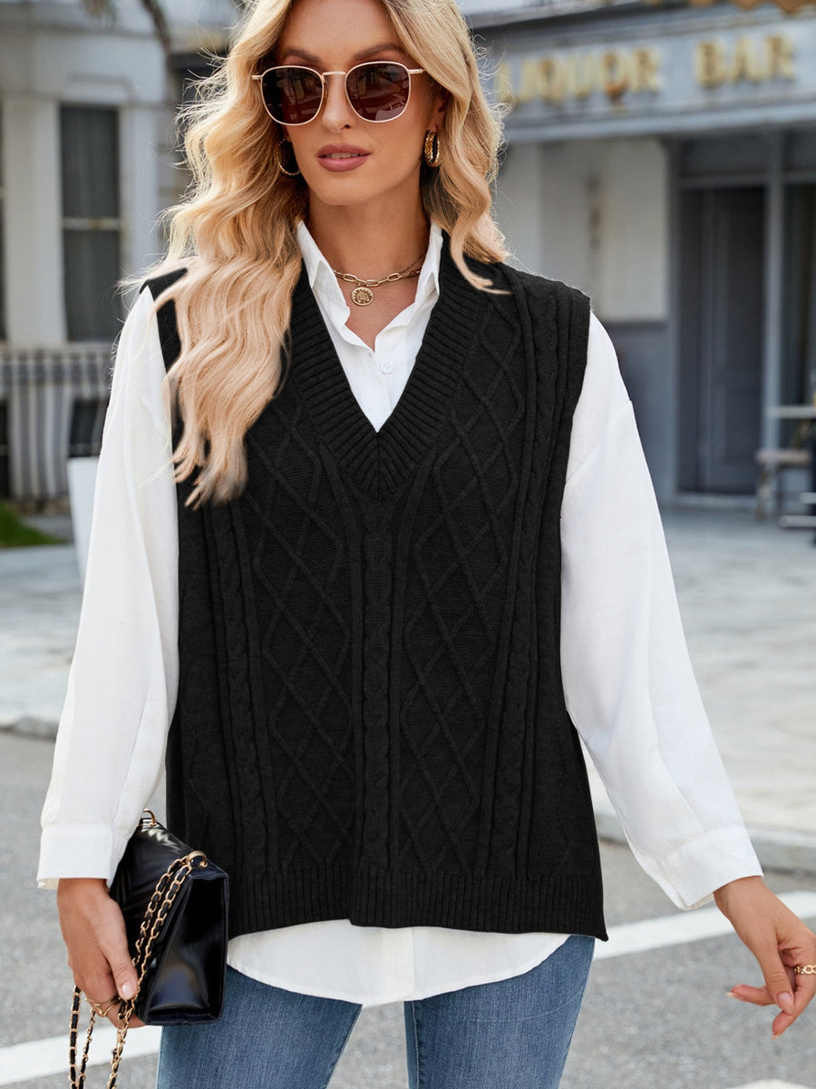 Black cable knit v-neck sweater vest with diamond pattern detail.