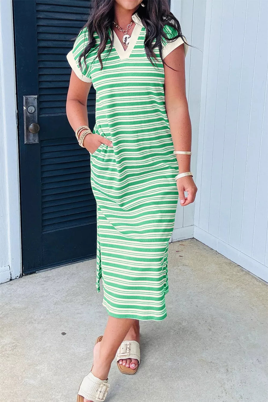 Green and white striped midi dress with V-neck, short sleeves, and pockets.