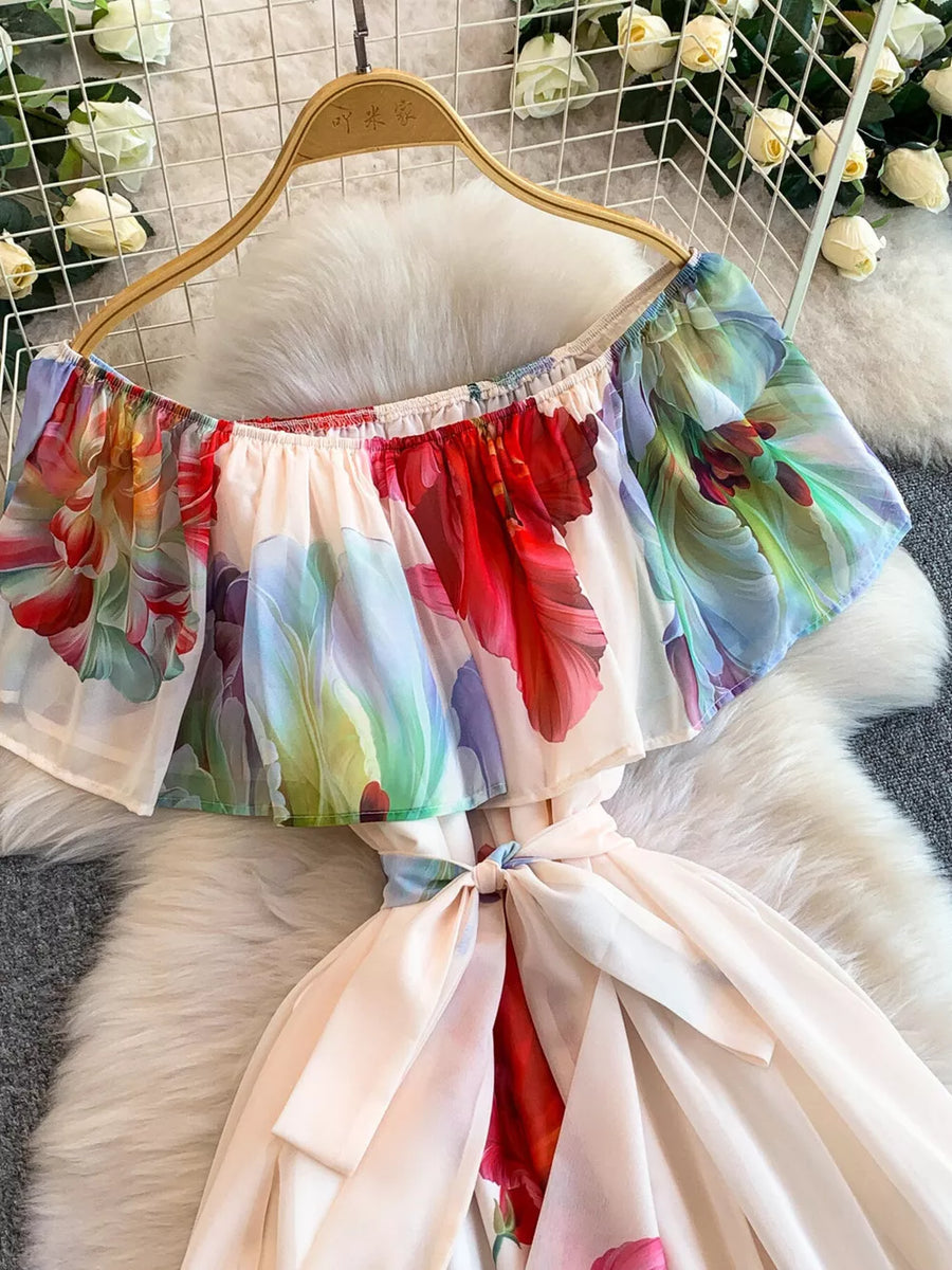 Botanical off-shoulder A-line dress in light pink with a floral print and belted waist.
