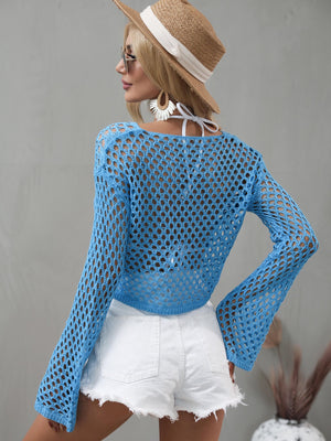 Blue open-knit acrylic beach crop sweater with bell sleeves and a square neckline.