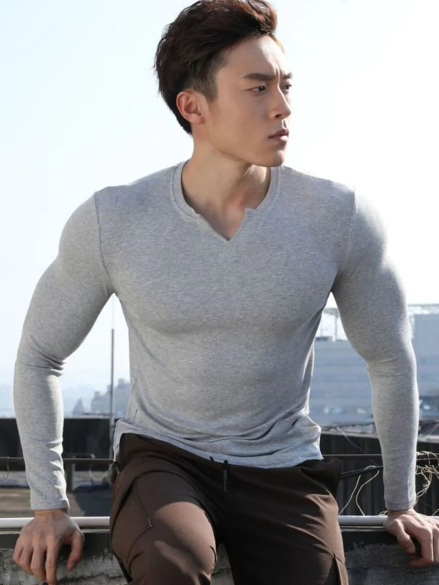 Gray ribbed long sleeve t-shirt with V-neck and notched detail