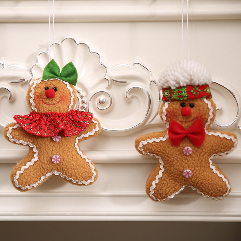 Gingerbread man holiday ornaments, one with a red ruffled collar and green bow, the other with a red bow tie and knitted hat.