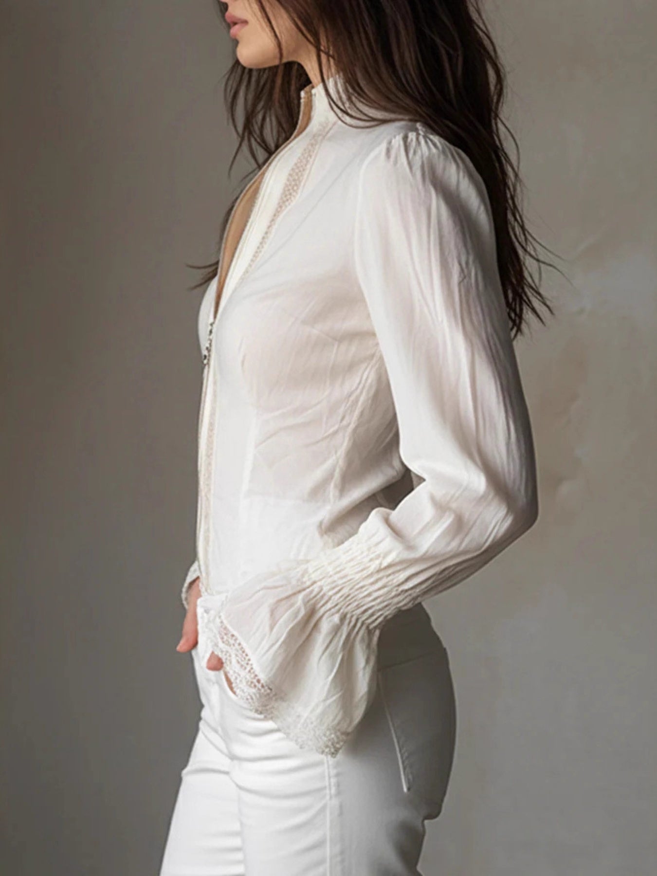 White lace trim stand-up collar shirt with bell cuffs and a zip front.