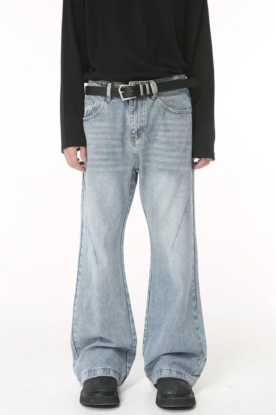 Flared denim jeans in medium wash with sculpted seam detail and a bootcut leg.