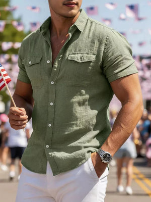 Army green short sleeve button-up shirt with two chest pockets and white buttons.