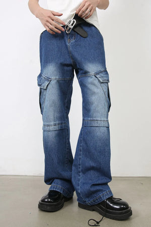 Cargo denim flare trousers in medium wash blue with multiple pockets and a relaxed fit.
