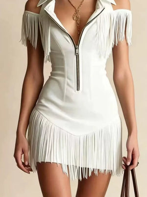White cold shoulder mini dress with fringe detail and zipper front.