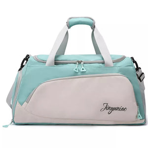 Medium waterproof duffel bag in light green and beige with multiple pockets and dual zippers.