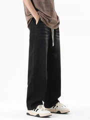 Black gray wide-leg jeans with drawstring and distressed details.