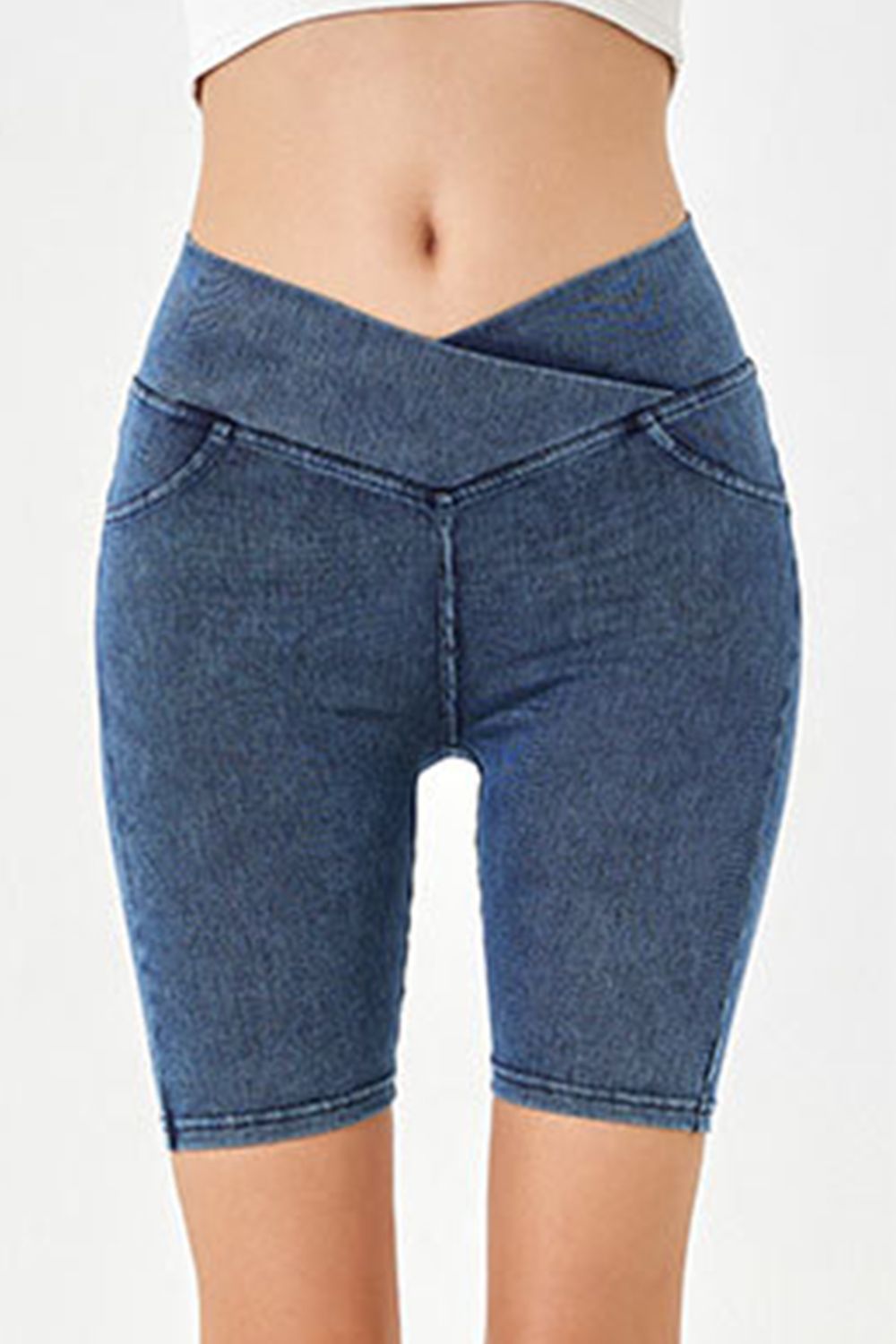 Denim bermuda shorts in medium blue with a crisscross waistband and faux pockets.