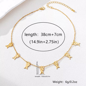 necklace in Gold with fish motif and charm details