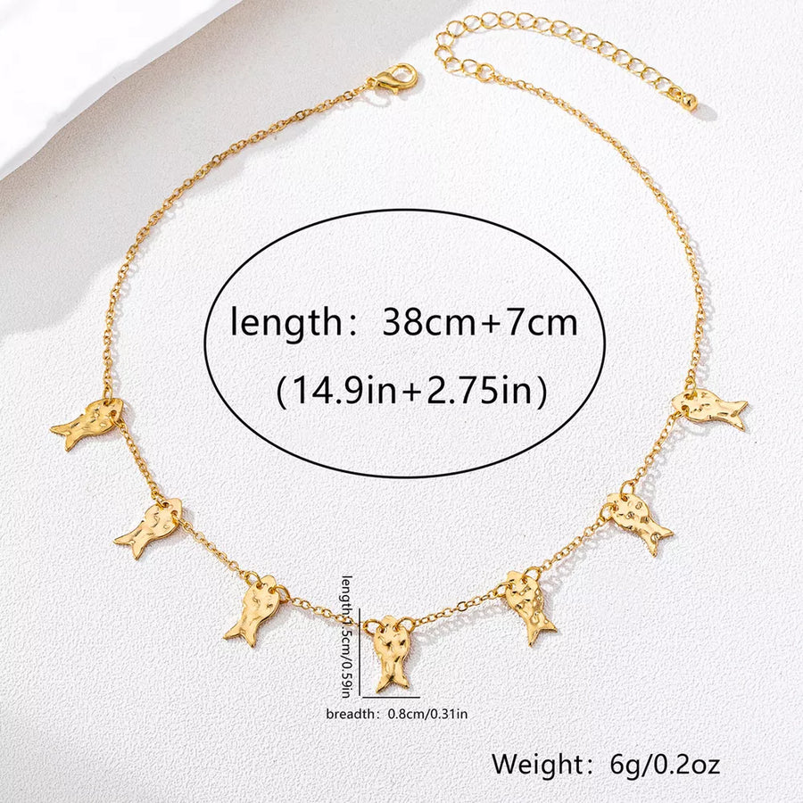 necklace in Gold with fish motif and charm details